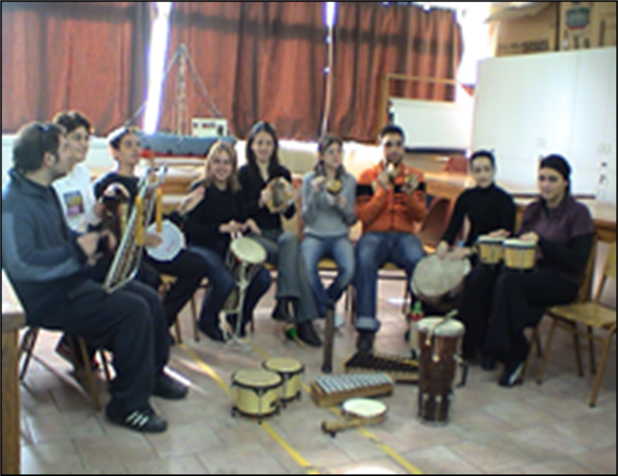 A group of people playing instruments

Description automatically generated with medium confidence